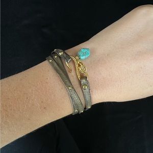 Like new leather wrap bracelet with gold trim and turquoise drop